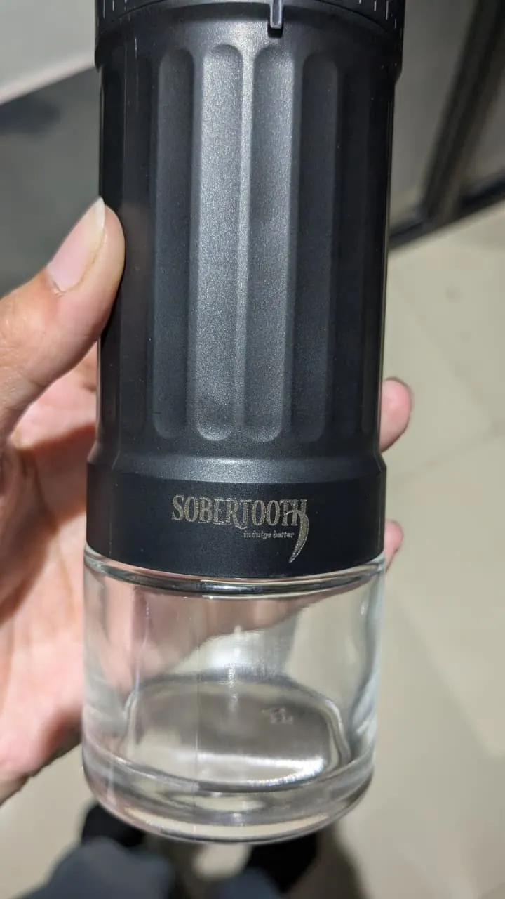 The grinder body and its glass catch jar