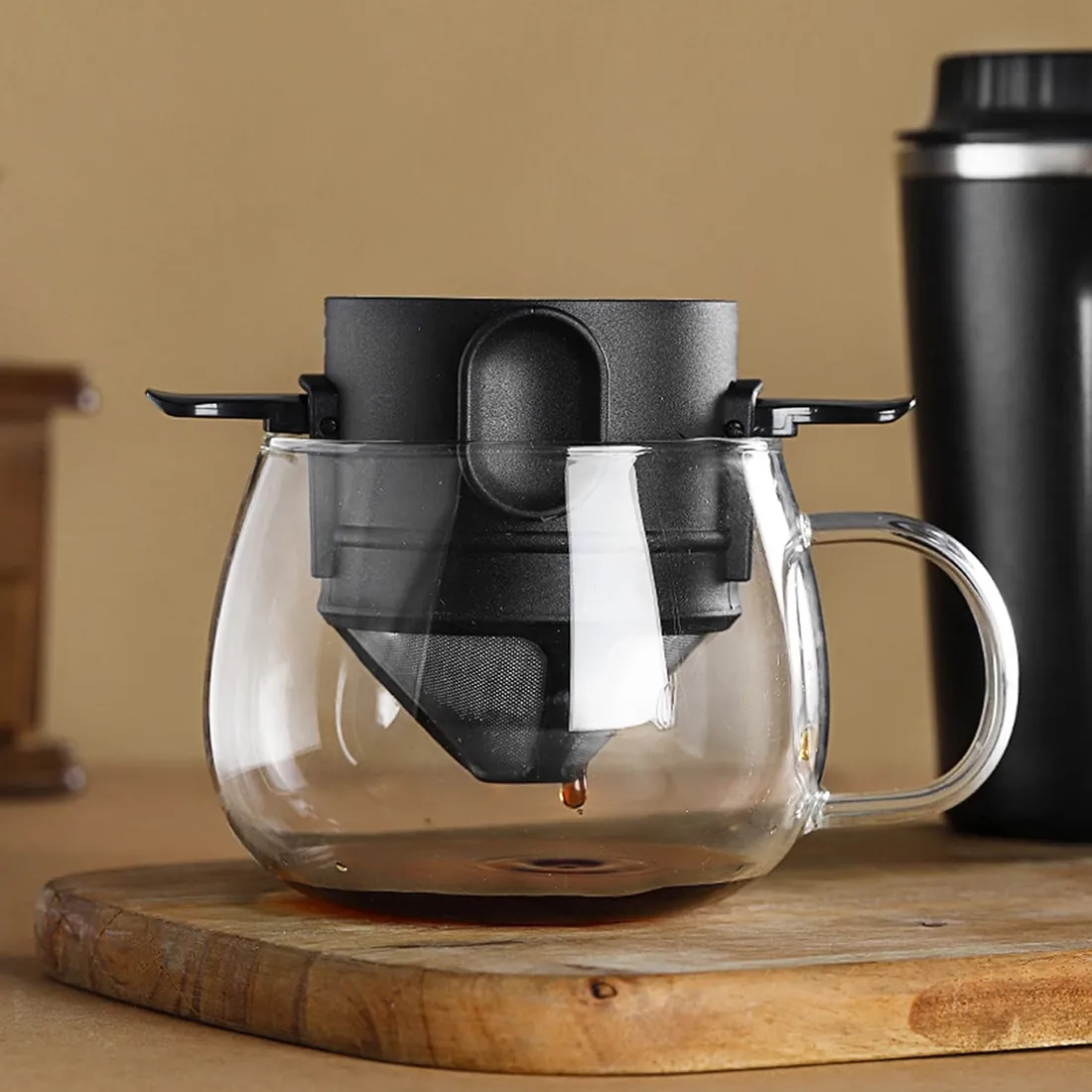 The pour over brewing into a glass mug